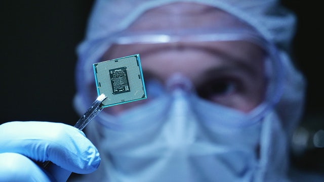 Image of a man holding  IC chip