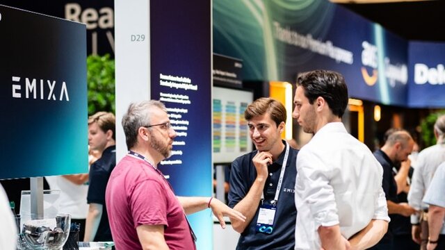 Attendees visiting a sponsor booth the Solutions Center at Realize Live Europe.