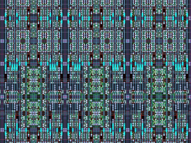 A magnified section of a silicon chip component layout.