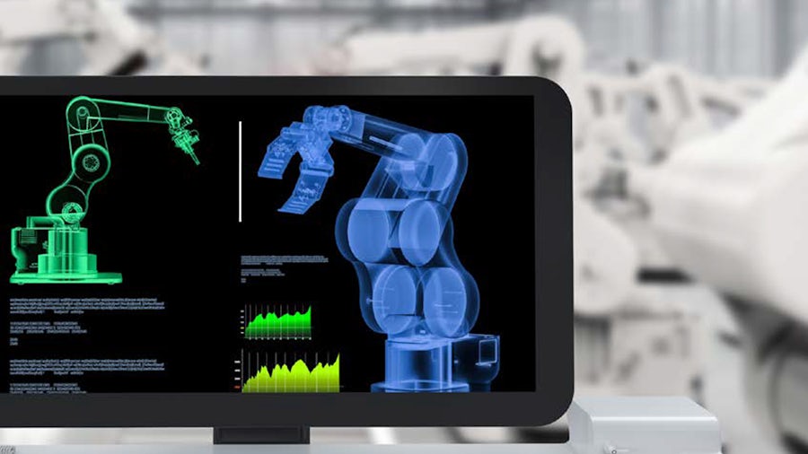 Low-code software on a computer monitor to analyze industrial robotic arms.