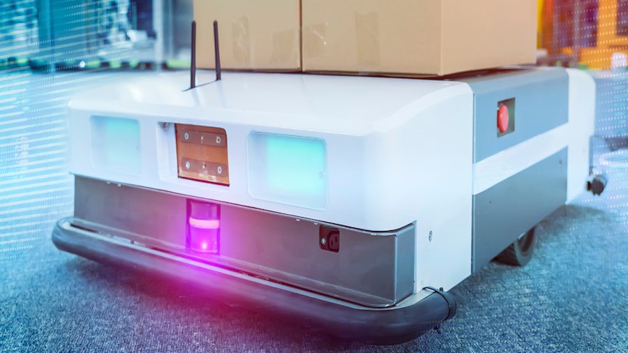 Image of a robot transporting boxes within a factory