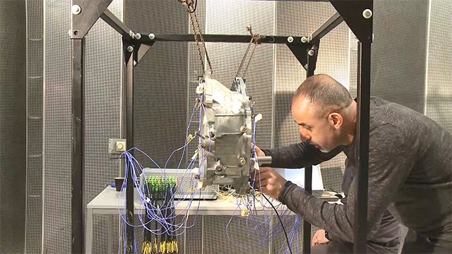 An engineer is performing structural dynamics testing on a component.