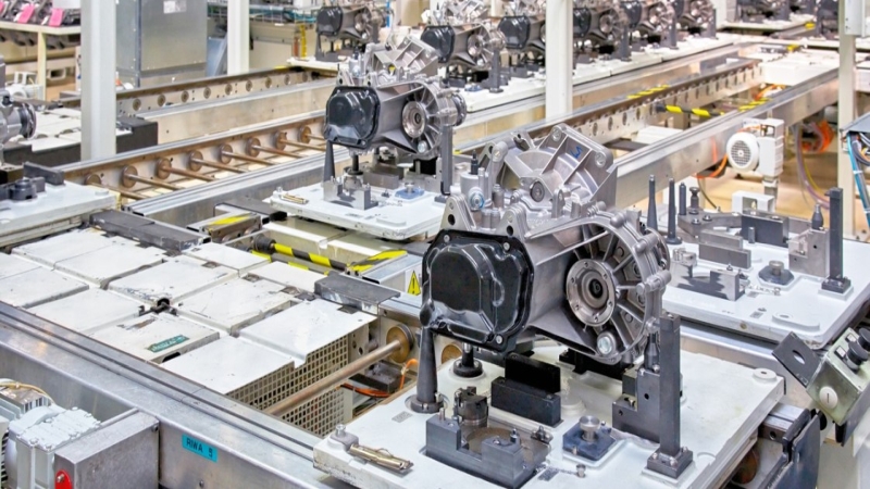 Car engines being built in a factory