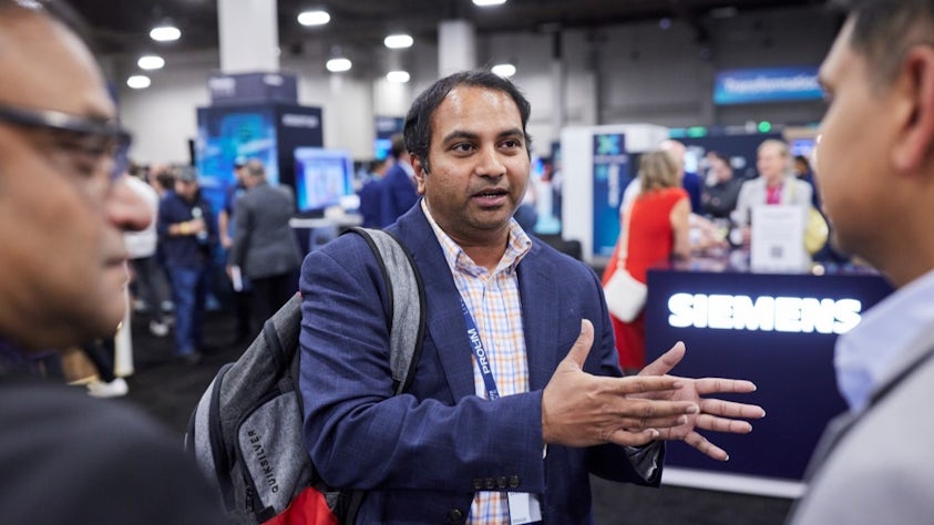 An attendee in the Realize LIVE Solution Center.