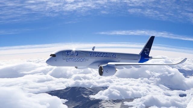A hydrogen-powered airplane flies above fluffy white clouds against a light blue sky