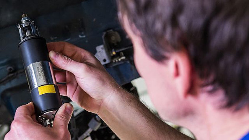 Engineer using a Simcenter advanced vibration testing equipment.