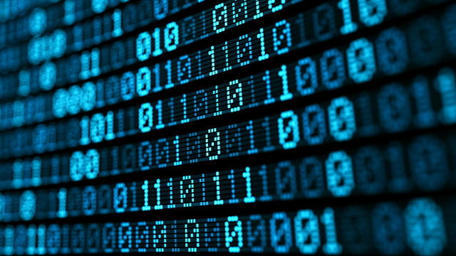 Digital screen displaying blue binary computer code.