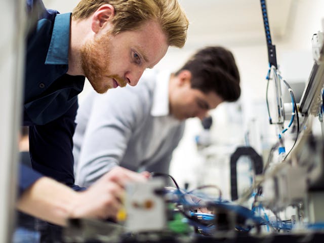 Engineers debugging and integrated circuit.