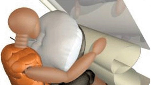 Computer simulation of a crash dummy hitting an airbag in a car