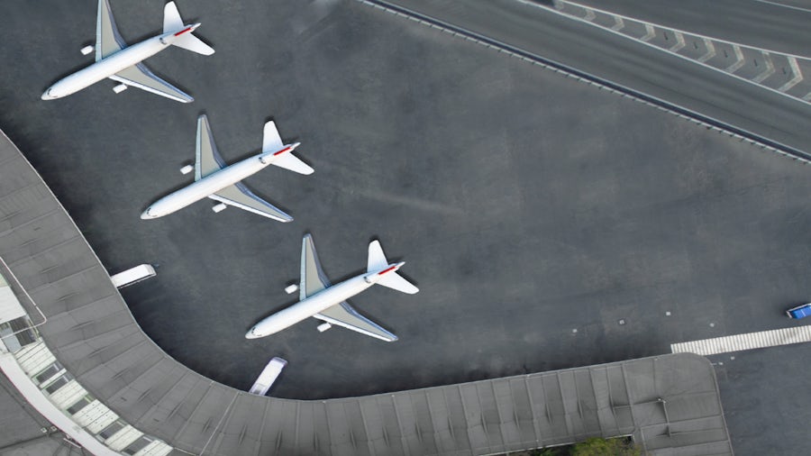 Airplanes parked at airport terminal