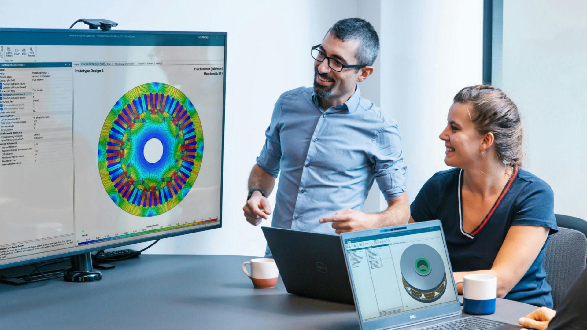 two engineers look at an electromagnetics simulation