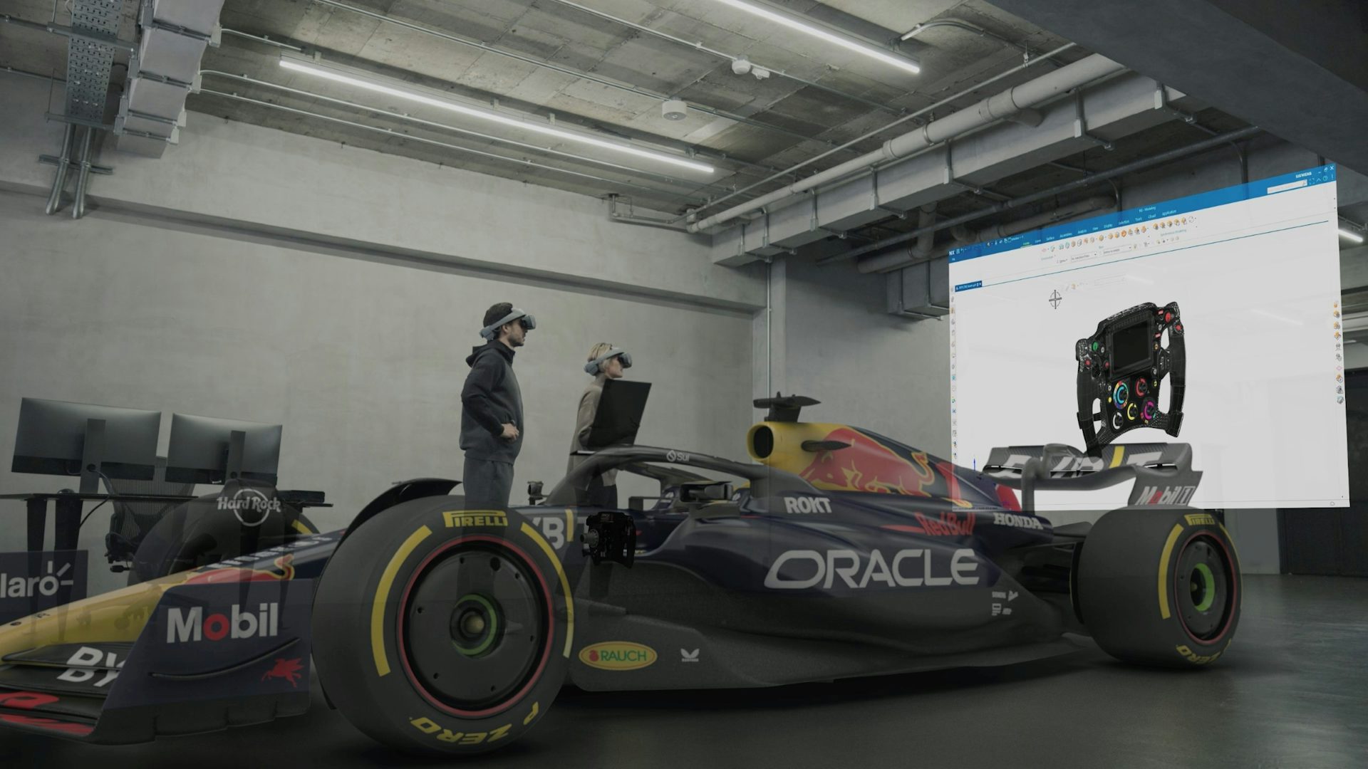 A team of engineers viewing the assembly of an Oracle Red Bull Racing Formula 1 car in their office in an immersive environment with Sony XR HMDs and a virtual monitor showing the design of the steering component.