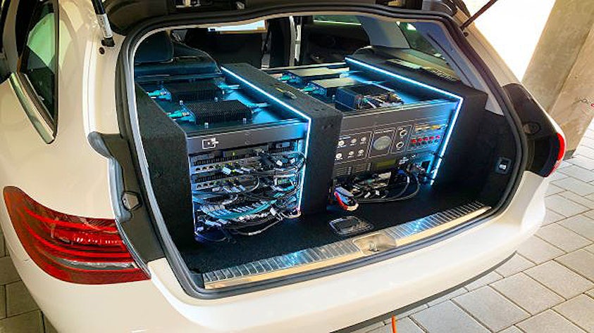 An ADAS data recording system in the rear trunk of a car.