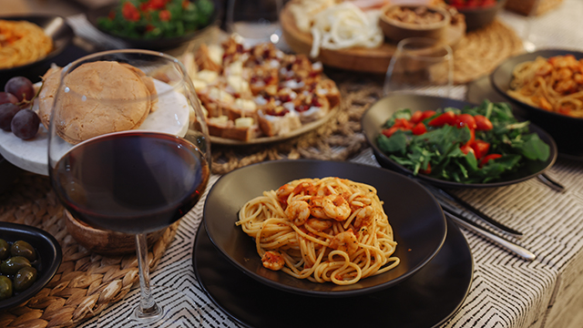 Family dinner for a celebration with red wine.