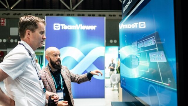 Two people discussing a case study in the Solutions Center.