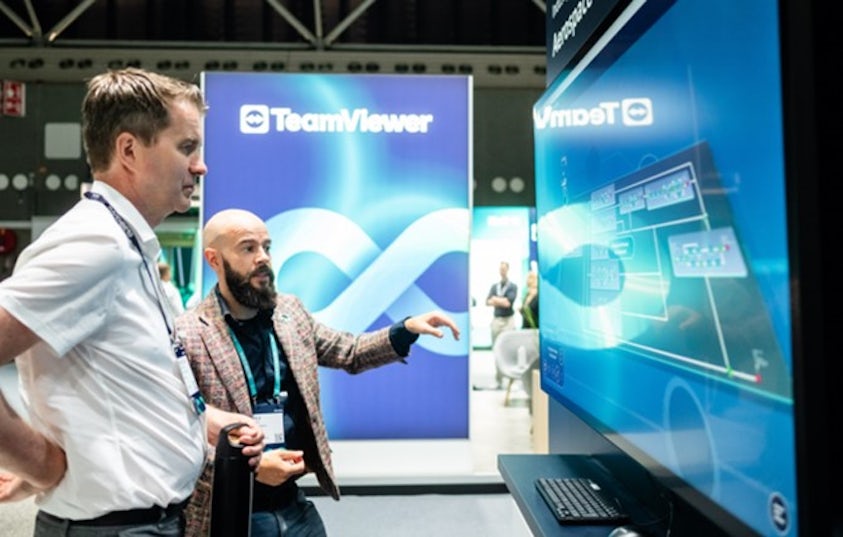 Two people discussing a case study in the Solutions Center.