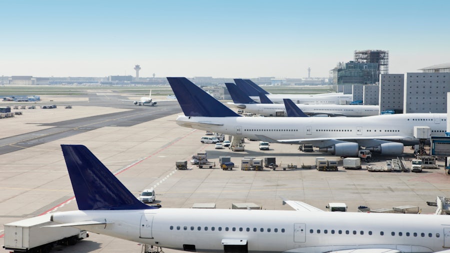 Commercial aircraft parked at a terminal at an airport. 