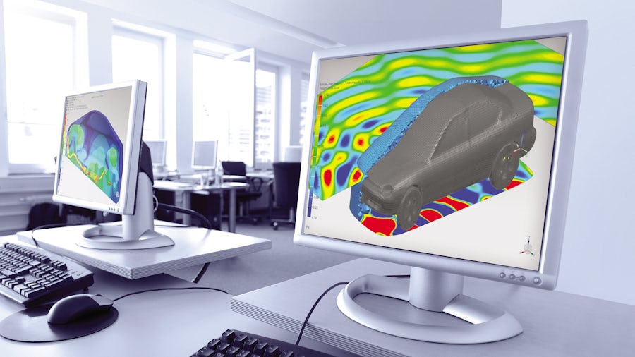 Two computer monitors showing acoustic simulation of the sound outside of an automobile.