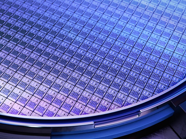 Close-up view of a silicon wafer with computer chips during the manufacturing process.