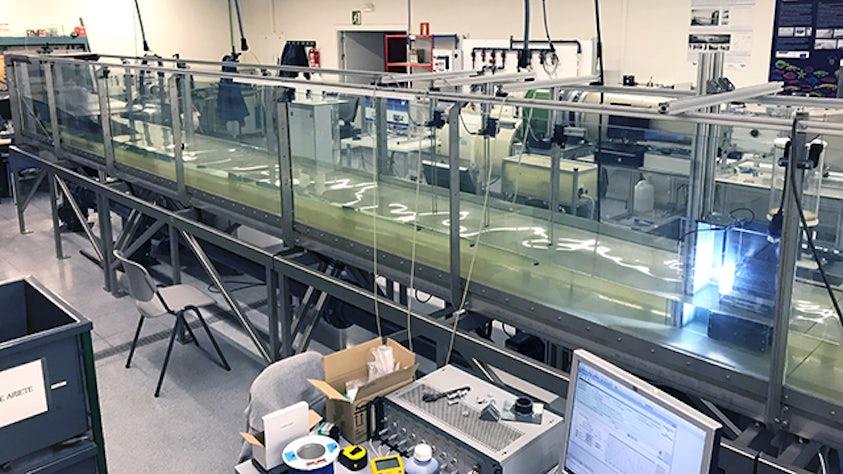 The student verified the simulation results with comparison tests in a large water tank at the laboratory.