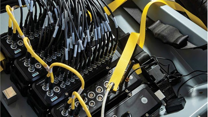 SCADAS RS hardware devices plugged in a car for a load testing.