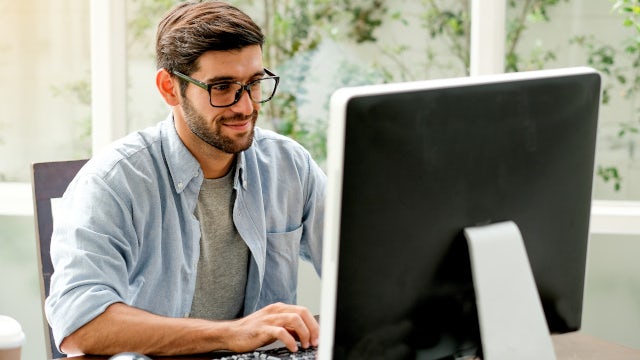 Person working at a computer.