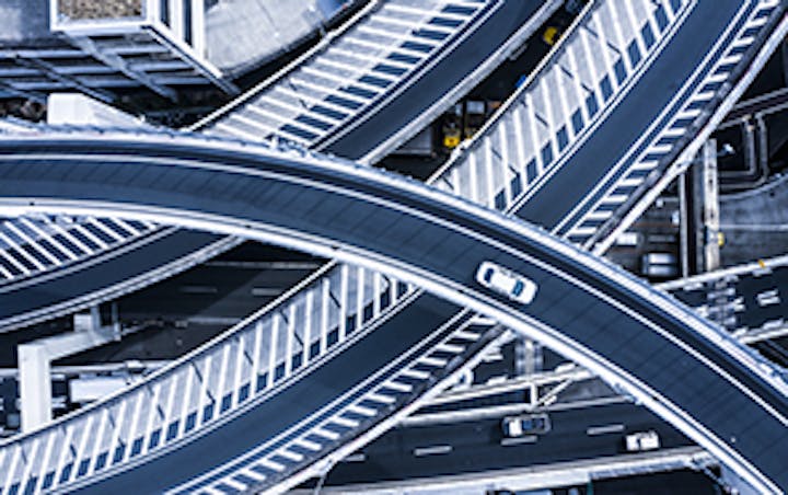 A car travels on a looping road with multiple connections.