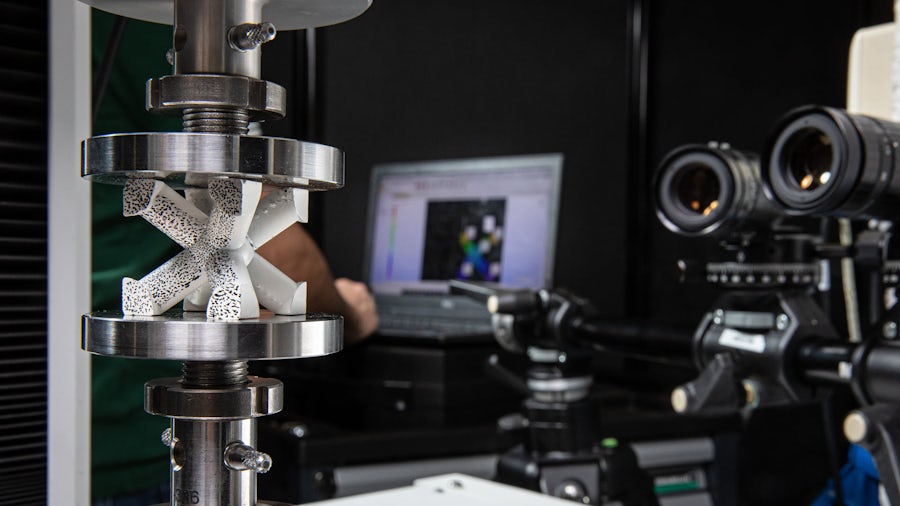 Digital image correlation cameras capturing structural performance of a part under load