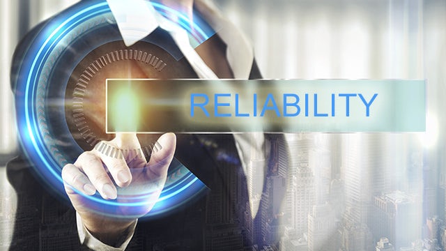 Hand touching glowing dial, text overlay "Reliability" | Calibre PERC reliability verification performs checks against electrical and physical design rules to reduce the risk of early or catastrophic IC failures.