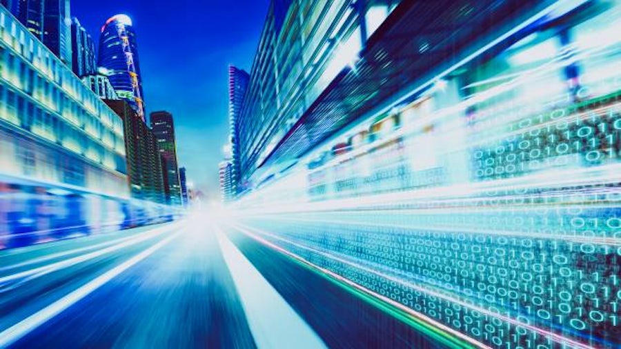 Fast-motion car driving through digital city