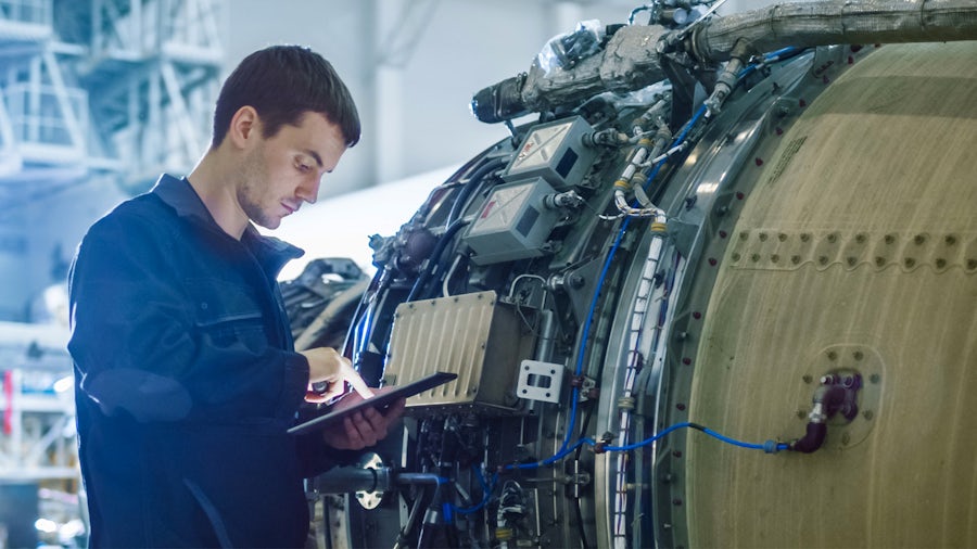 Man working on manufacturing equipment