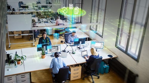 Four workers sitting down collaborating under a green digital illustration