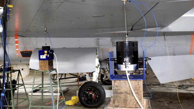 Modal testing units attached to an airplane.