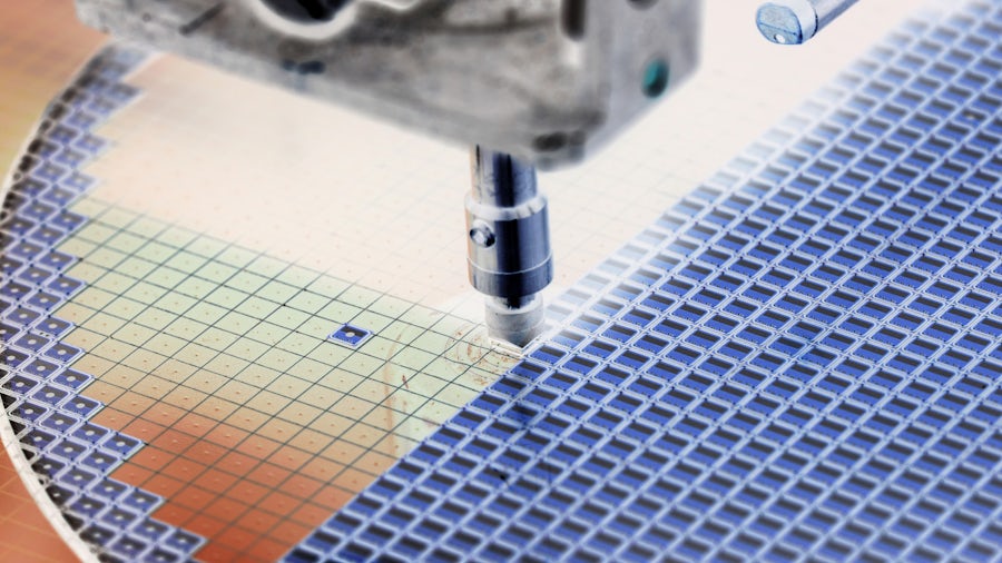 Semiconductor chip being tooled by a machine 