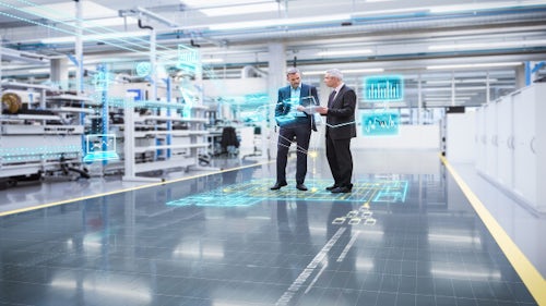 Two managers in a digital twin factory